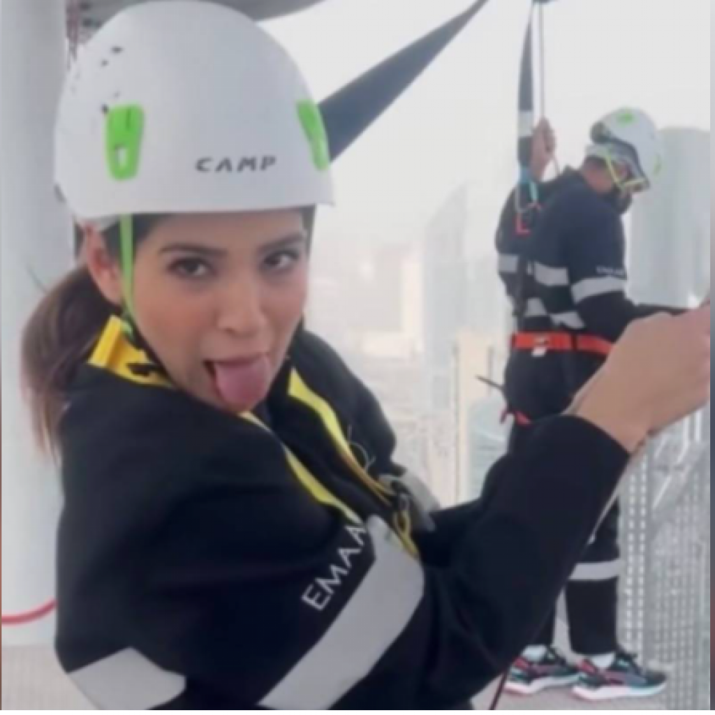 ayesha-omar-slides-down-glass-tube-from-dubai-building-top